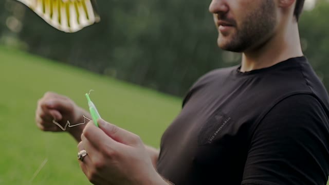 Guy Is Winding A Kite