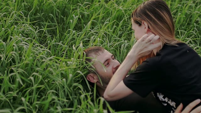 Young Couple Lies On The Grass