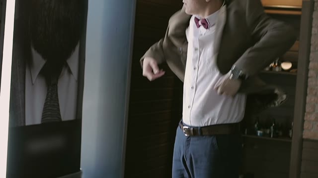 Young Guy Puts On A Jacket