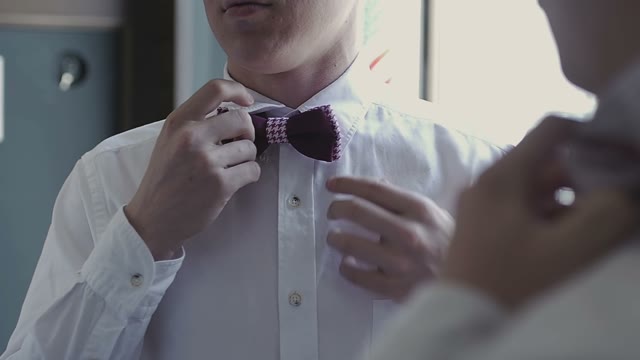 Men Tying A Bow Tie