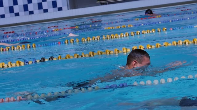 Man Is Engaged In Swimming In The Pool