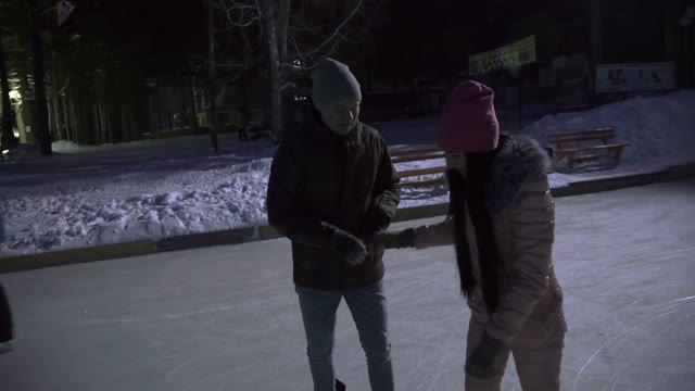 Young Couple Stops And Holds Hands