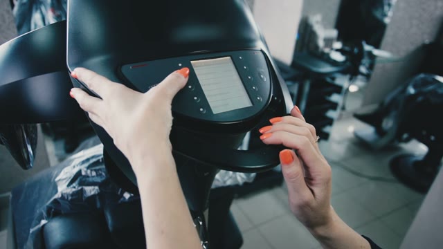 Hairdresser Adjusts The Vaporizer