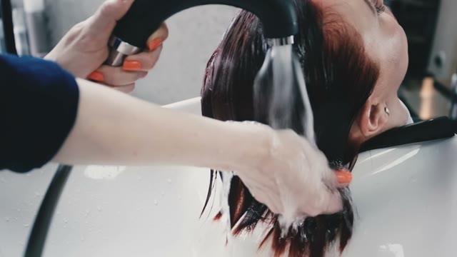 Hairdresser Is Washing Client Hair With His Hands