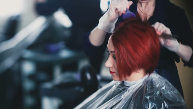 Girl Master Paints Hair To A Smiling Client