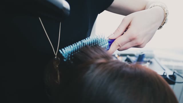 Hairdresser Puts Hair To The Client In The Salon