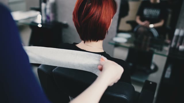 Hairdresser Prepares The Client For A Hairstyle