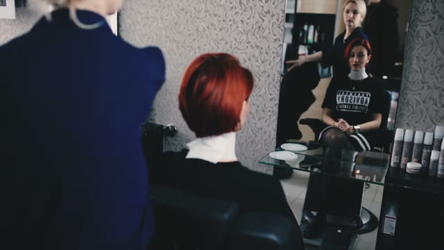 Girl In The Salon Prepares For A Haircut
