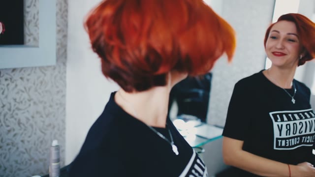 Girl With Red Hair Looks At The Camera