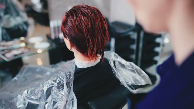 Hairdresser Removes Cellophane Film From The Client