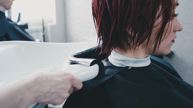 Girl With Wet Hair Puts Her Head On The Sink