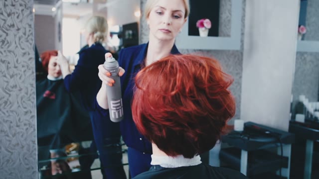 Hairdresser Makes Up The Hairstyle To The Client