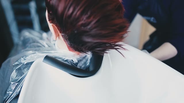Client's Head Is Placed On The Sink