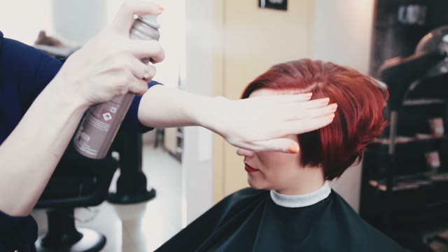 Hairdresser Apply Spray On Hair