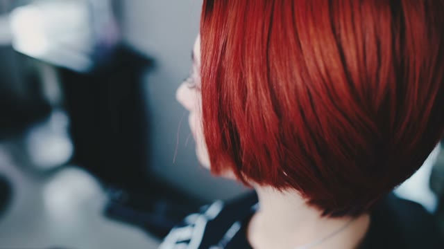 Red-haired Girl Stroking Her Hair