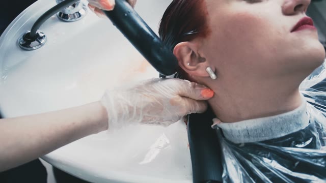 Girl In The Salon Gently Wash Her Hair