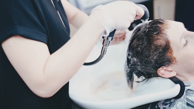 Girl Is Washed Off The Mask On The Hair