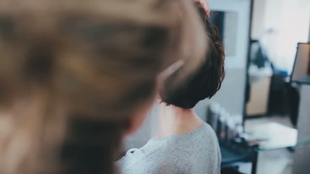 Hairdresser Does Hairstyle To The Client