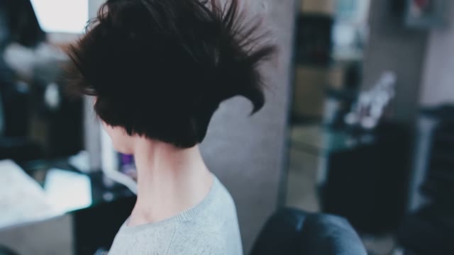 Hairdresser Dries Hair With A Hair Dryer And Touches Them With His Hand