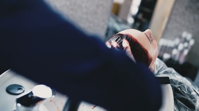 Client Of Salon Wash Off A Red Paint From Hair