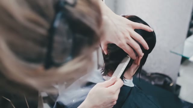 Hairdresser Combs Wet Hair