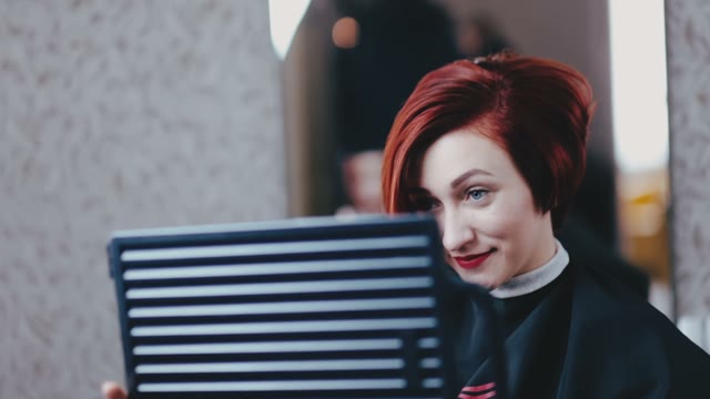 Girl Looks In The Mirror And Smiles