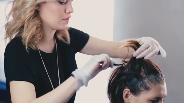 Colorist Works With Concentration