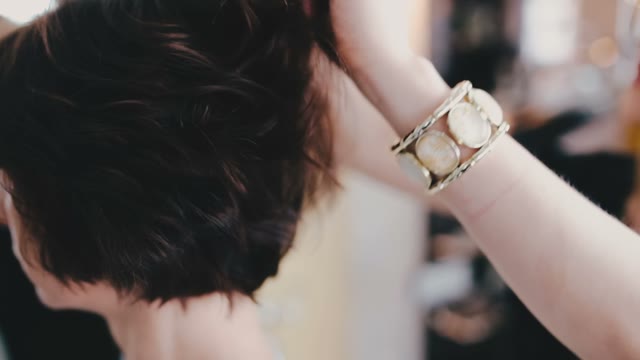 Hairdresser Ruffles The Client's Hair