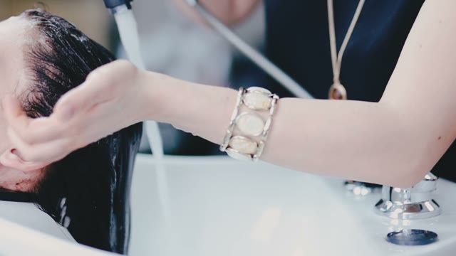 Woman Pours Water On Her Hair To The Client