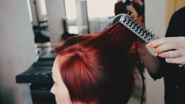 Hairdresser Dries Hair To The Client