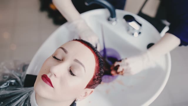 Client Of Salon Wash Off A Paint From Hair