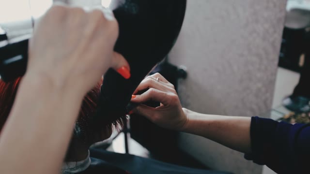 Hairdresser Dries Hair To The Customer