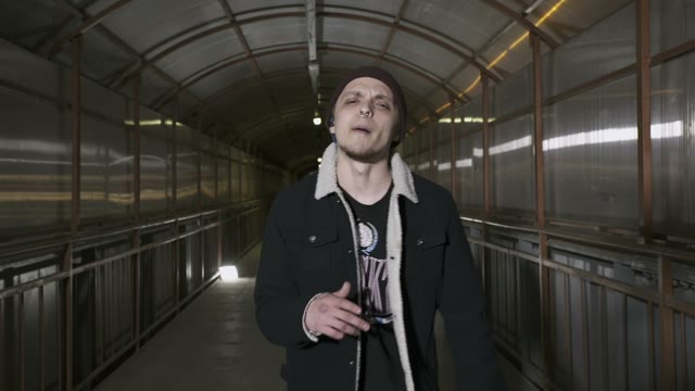 Guy Reads Rap Looking Camera