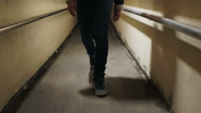 Guy Sneakers Walking Along Cor