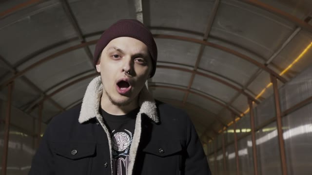 Rapper Reads Rap And Puts His Hands On Himself Face