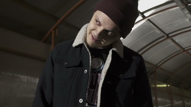 Guy Bends His Head And Looks F