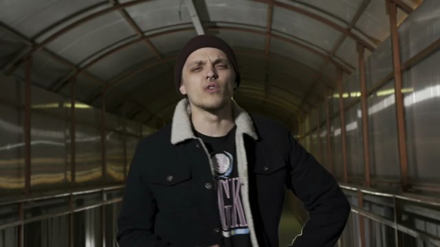 Guy Shows Different Gestures To The Camera And Reads Rap
