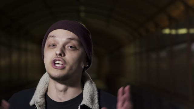 Guy Reads Rap And Waves His Ha