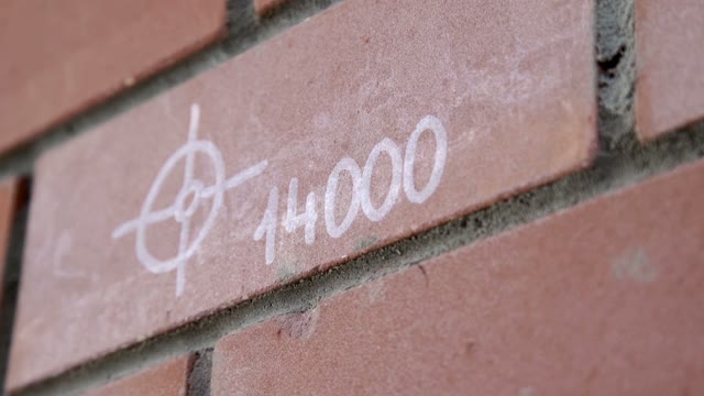 Brick Wall With An Inscription
