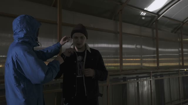 Operator Approaches The Rapper And Corrects The Earpiece In His Ear