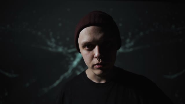 Guy Looks Camera And Reads Rap