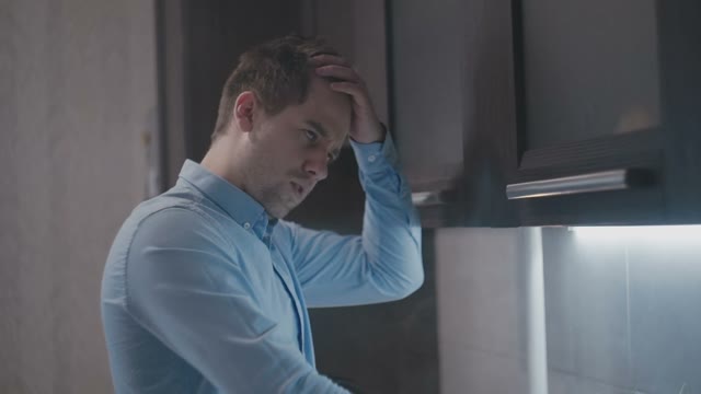Young Guy Scratches His Head And Thinks
