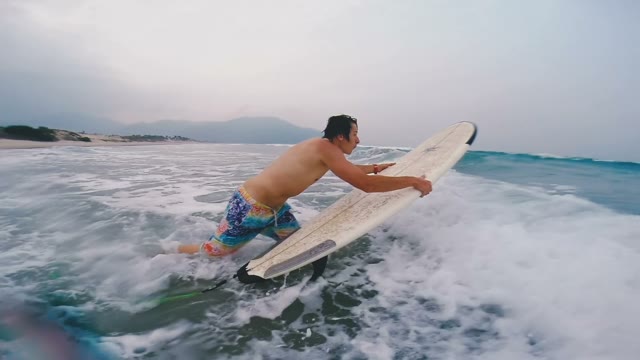 Guy Jumps On The Board And Swims