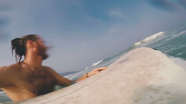 Guy With The Board Is Catching A Wave