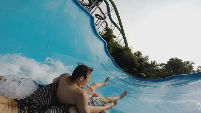 Two Friends Are Riding On An Inflatable Lap