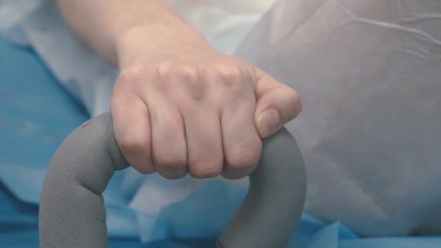 Girl Grabs The Handrail During Childbirth
