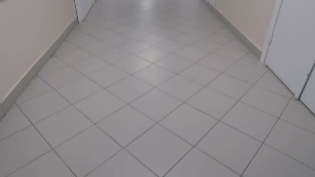 At The End Of The Hospital Corridor A Woman
