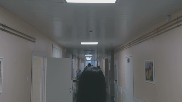 Girl In The Corridor Looks Ahead