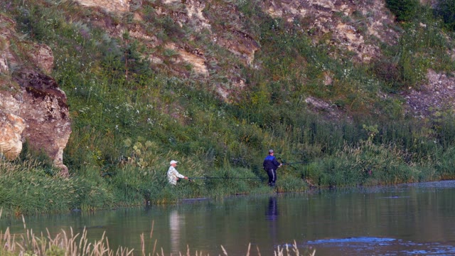 Men Catch Fish On The Beach